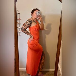Orange midi dress with asymmetrical design #midi #asymmetrical